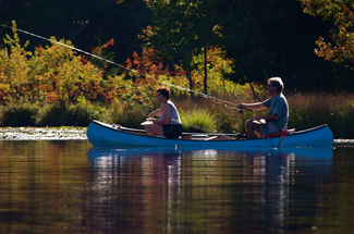 Two people enjoy fishing on Atlantic County Park at Lake Lenape